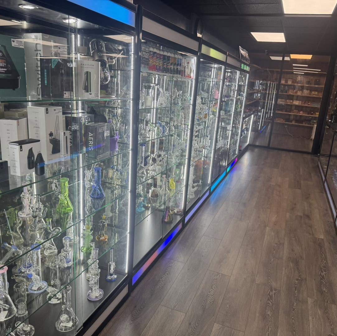 Premium glass cases with LED lighting at Puff n' Go